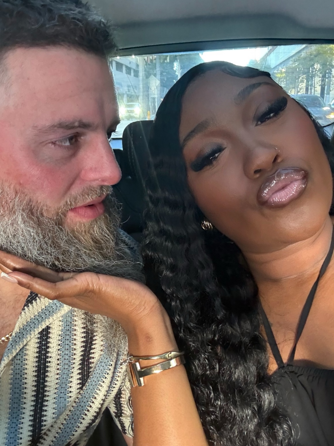 Centoria and Luther together in a car